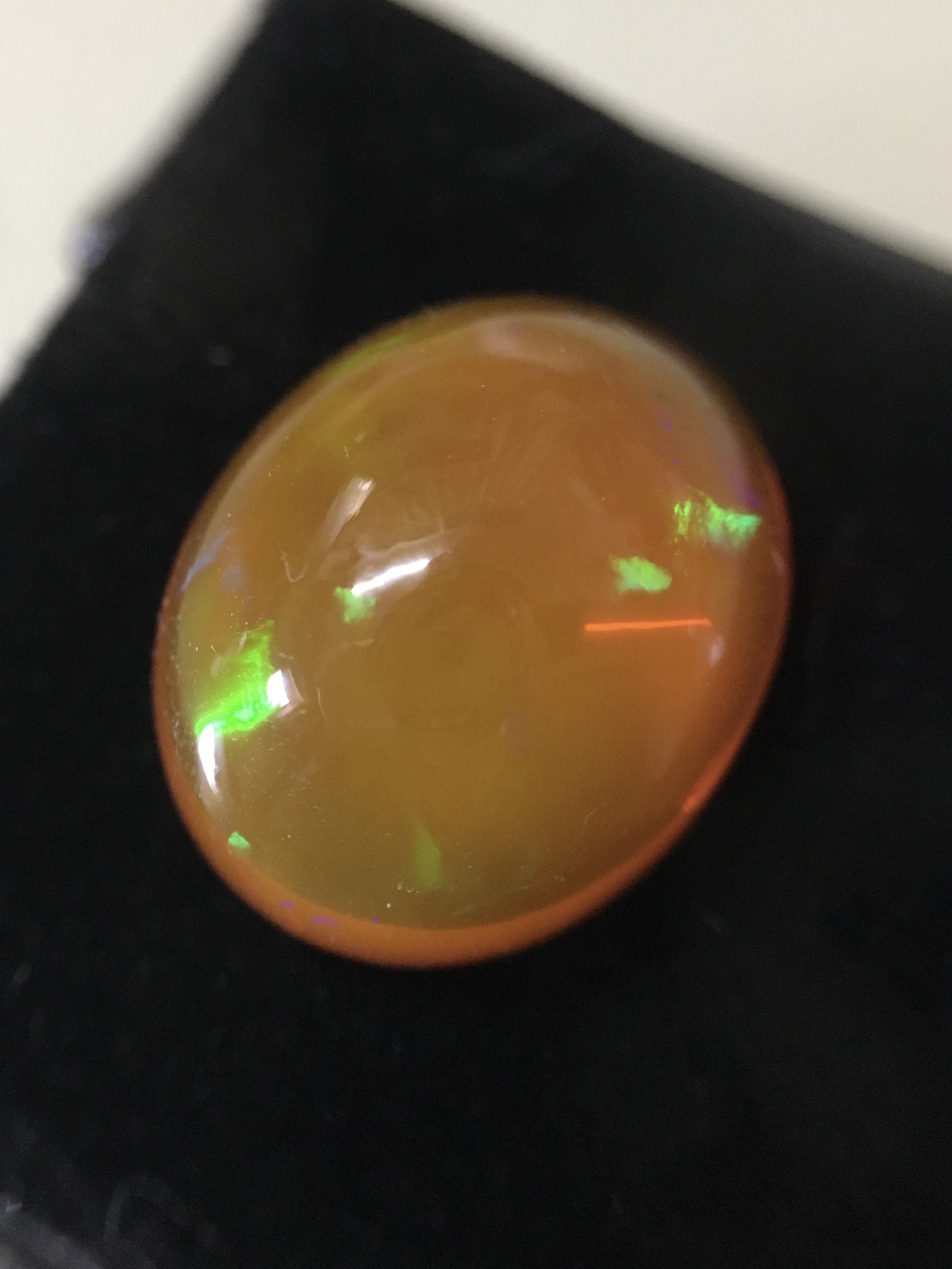 FIRE OPAL โอปอลไฟ แท้ 6.8 กะรัต ทรงไข่อ้วนๆ รุ้งหลากสี สวยธรรมชาติสร้าง