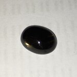 Black Star Sapphire แบล็คสตาร์แท้ 3.49 กะรัต มีดวงไฟสีทองเล็กๆอยู่ข้างๆเม็ด เม็ดนี้สวยไม่เหมือนใครค่ะ